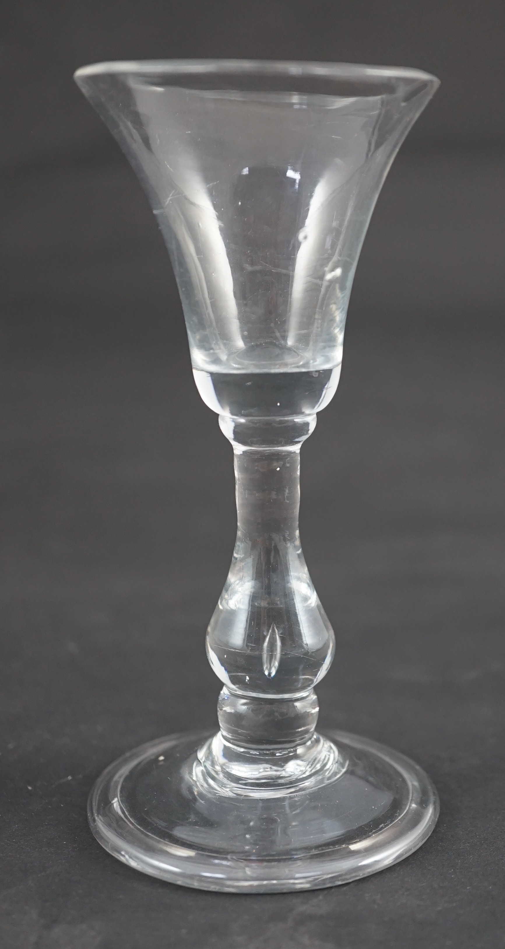 A Georgian baluster glass with teardrop air bubble stem, c.1730, 12.5cm high